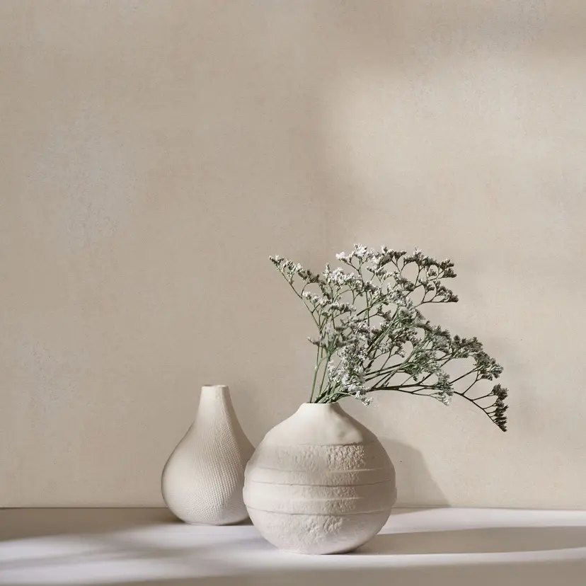 Papel pintado no tejido con aspecto de hormigón beige utilizado aspecto liso